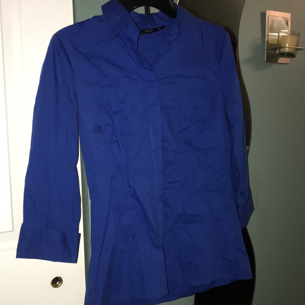 Vibrant blue blouse.